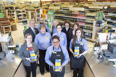 The team at the Dupont and Spadina LCBO store in Toronto join Susan Drodge (far left) of the Canadian Cancer Society to kick off Daffodil Month pin sales efforts at the LCBO'’s more than 650 stores across Ontario. (CNW Group/Canadian Cancer Society (Ontario Division))