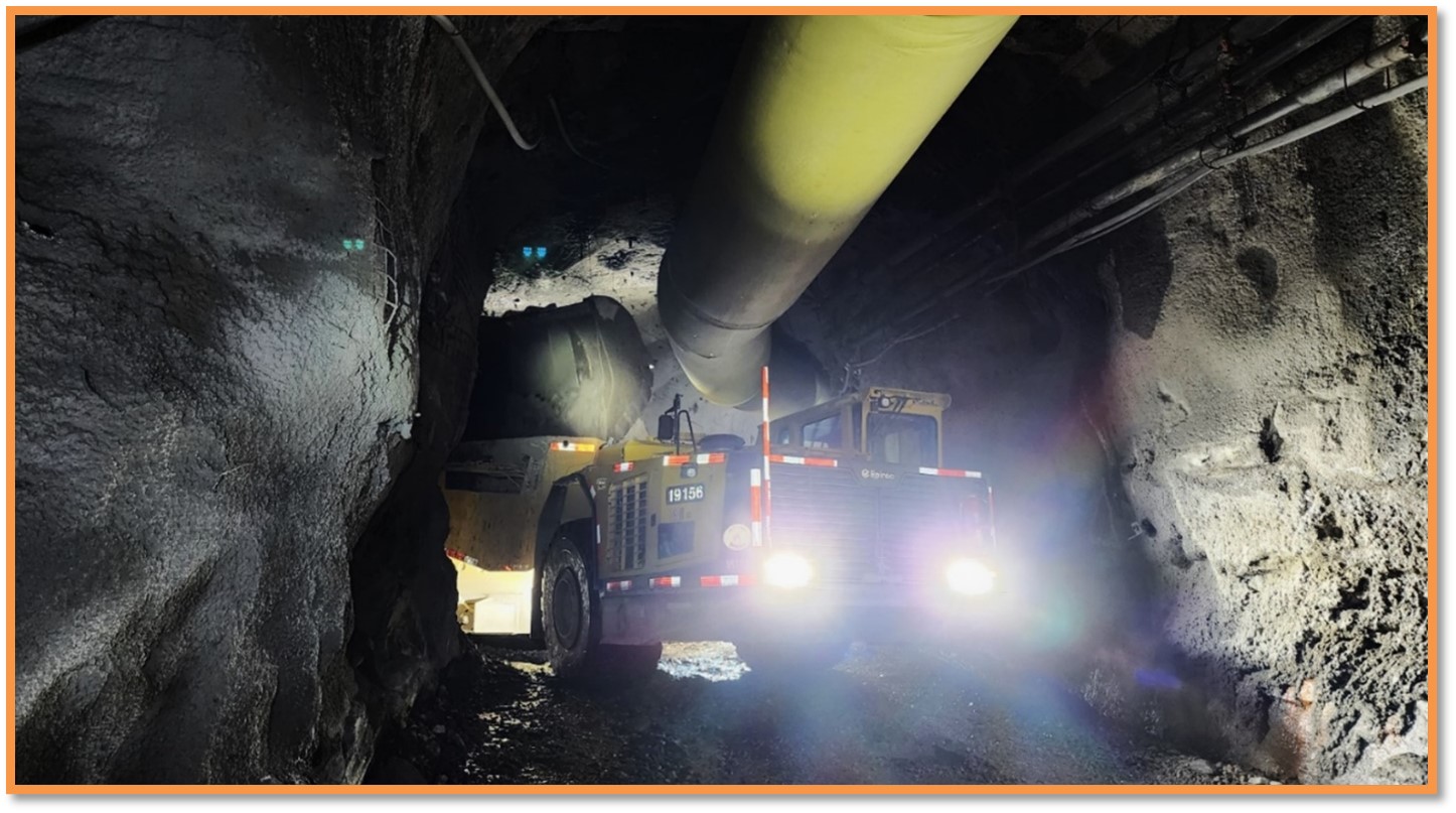 Haul truck being loaded underground