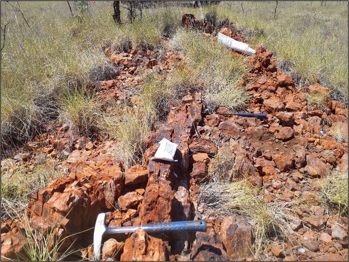 Mineralised gossan on the southern porphyry margin looking east. Sample R00988 (taken at the position of the central front sample bag) returned assays of 4.6 ppm Au, 99 ppm Ag, and 1.4% Pb(4) .