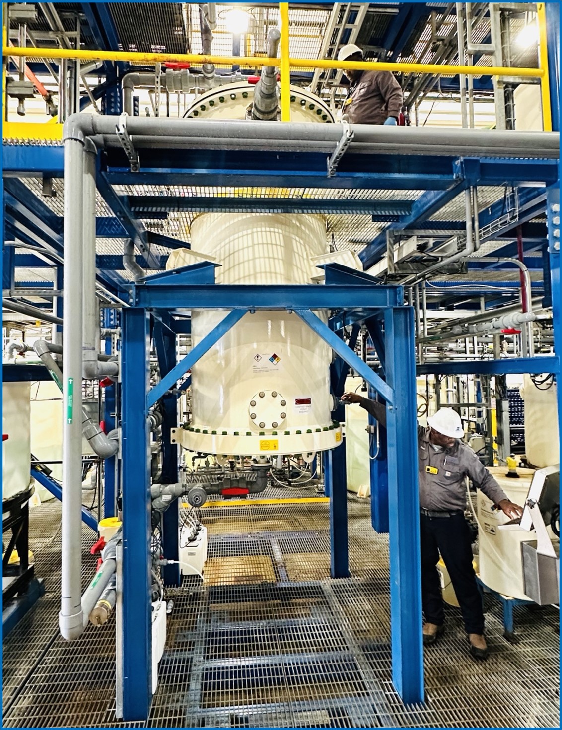 Side elevation of operators working on the commercial-scale DLE column at Standard Lithium’s Demonstration Plant near El Dorado, Arkansas