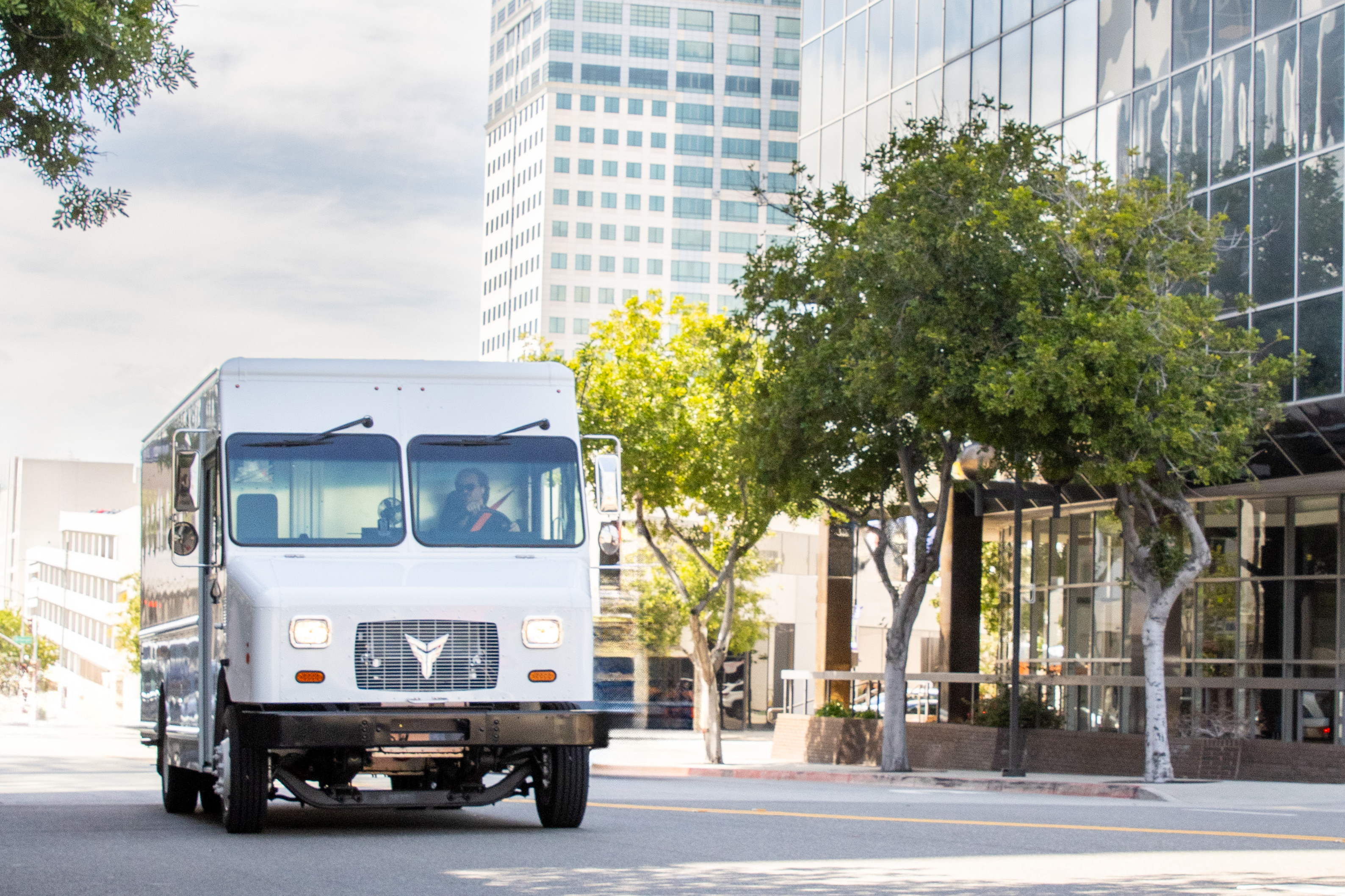 Xos SV Stepvan driving on an urban city street